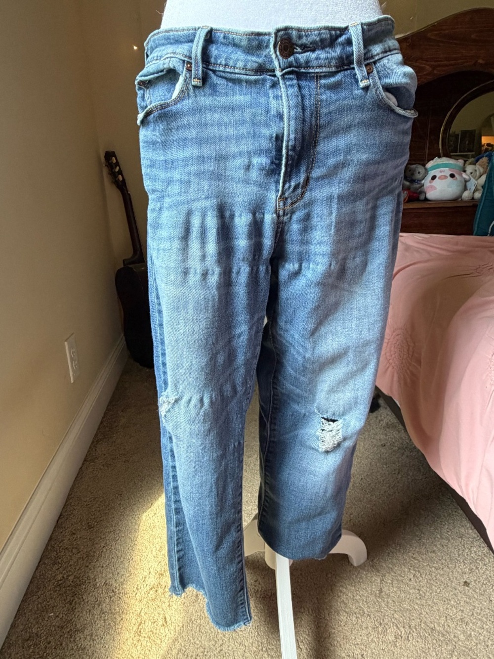Distressed Levi's High Rise cropped jeans